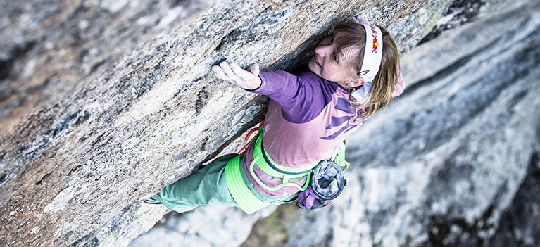 Woman climbing using Edelrid chalk bag